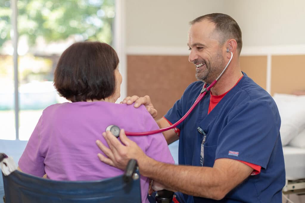 Marysville Nurse with a resident in a wheelchair